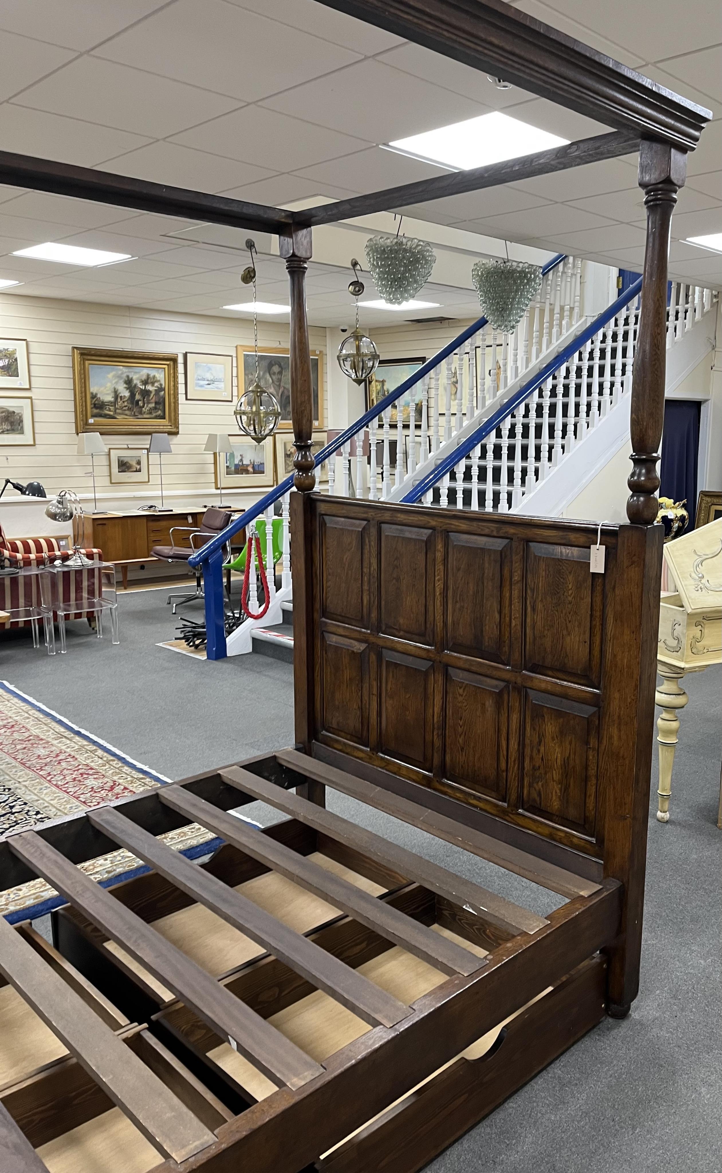 A reproduction 17th century style oak four poster bed frame, width 140cm, length 210cm, height 223cm. Condition - good